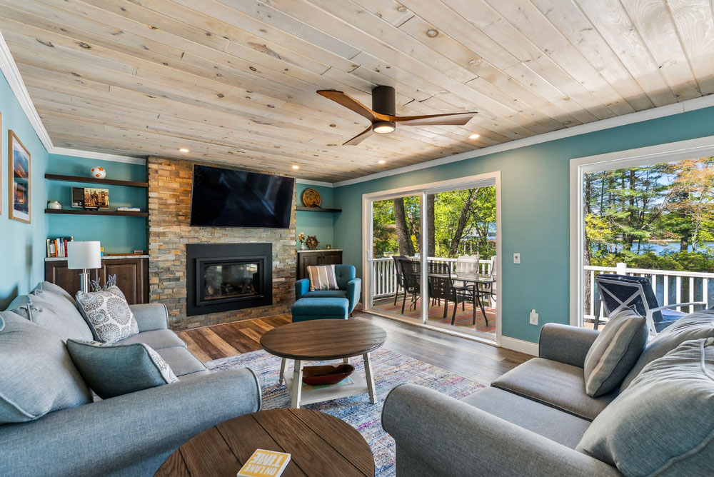 Open concept living room with access to the upper deck
