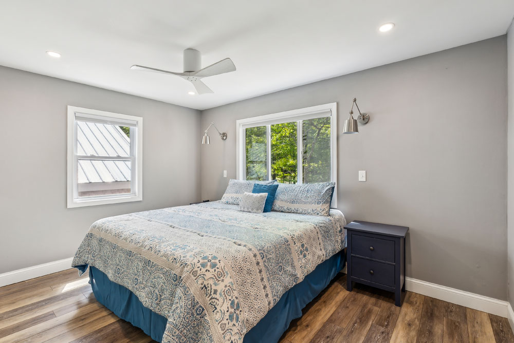 King bed from primary bedroom on the upper floor with attached full bathroom