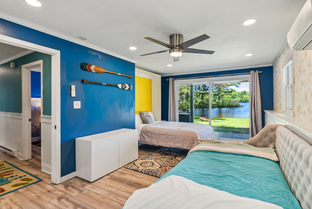 Lower level room with slider access to the lake. Queen bed and single day bed with single trundle.