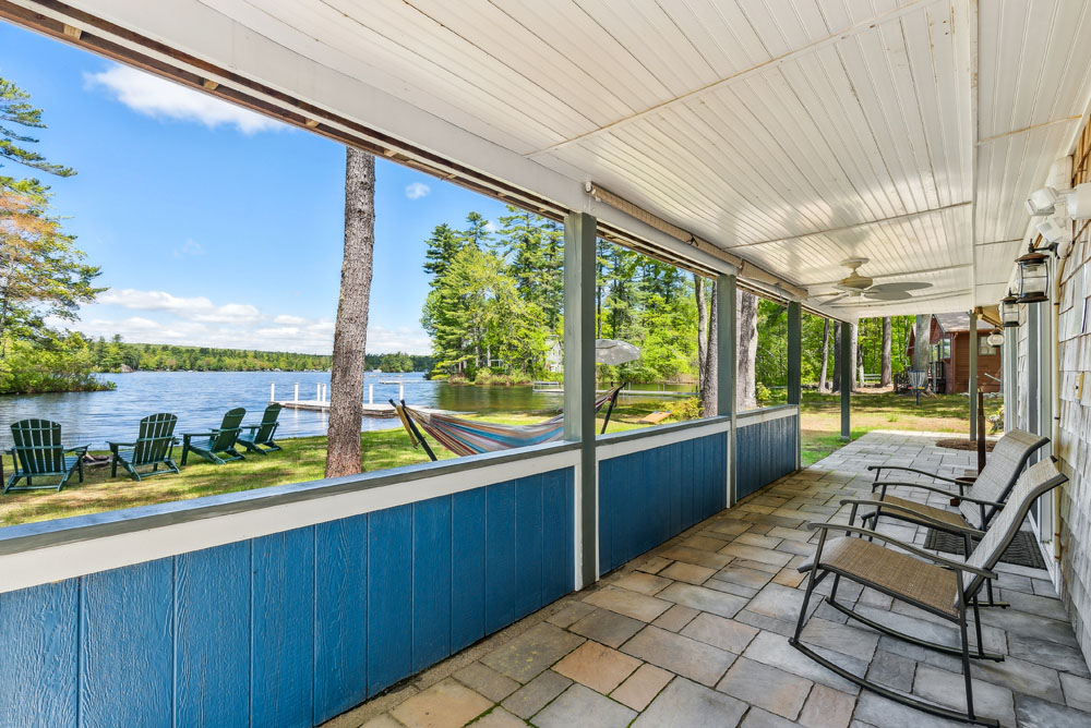 Lower patio with rocking chairs and access from lower bedrooms and living room