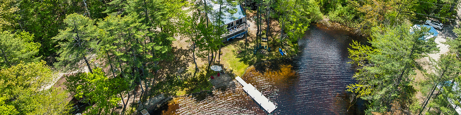 aerial shot of rental home and lake